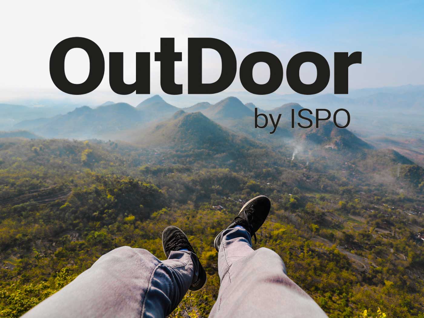 Logo von der OutDoor by ISPO auf einem Bergpanorama