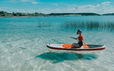A person on a small boat in a body of water